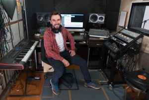 Music producer working at a recording studio