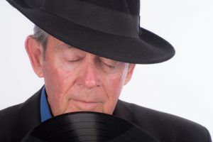 Older man longing for the days of vinyl records.